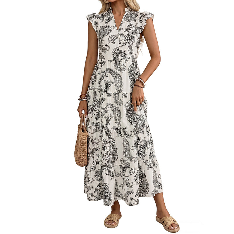 Woman wearing a patterned dress on a white background
