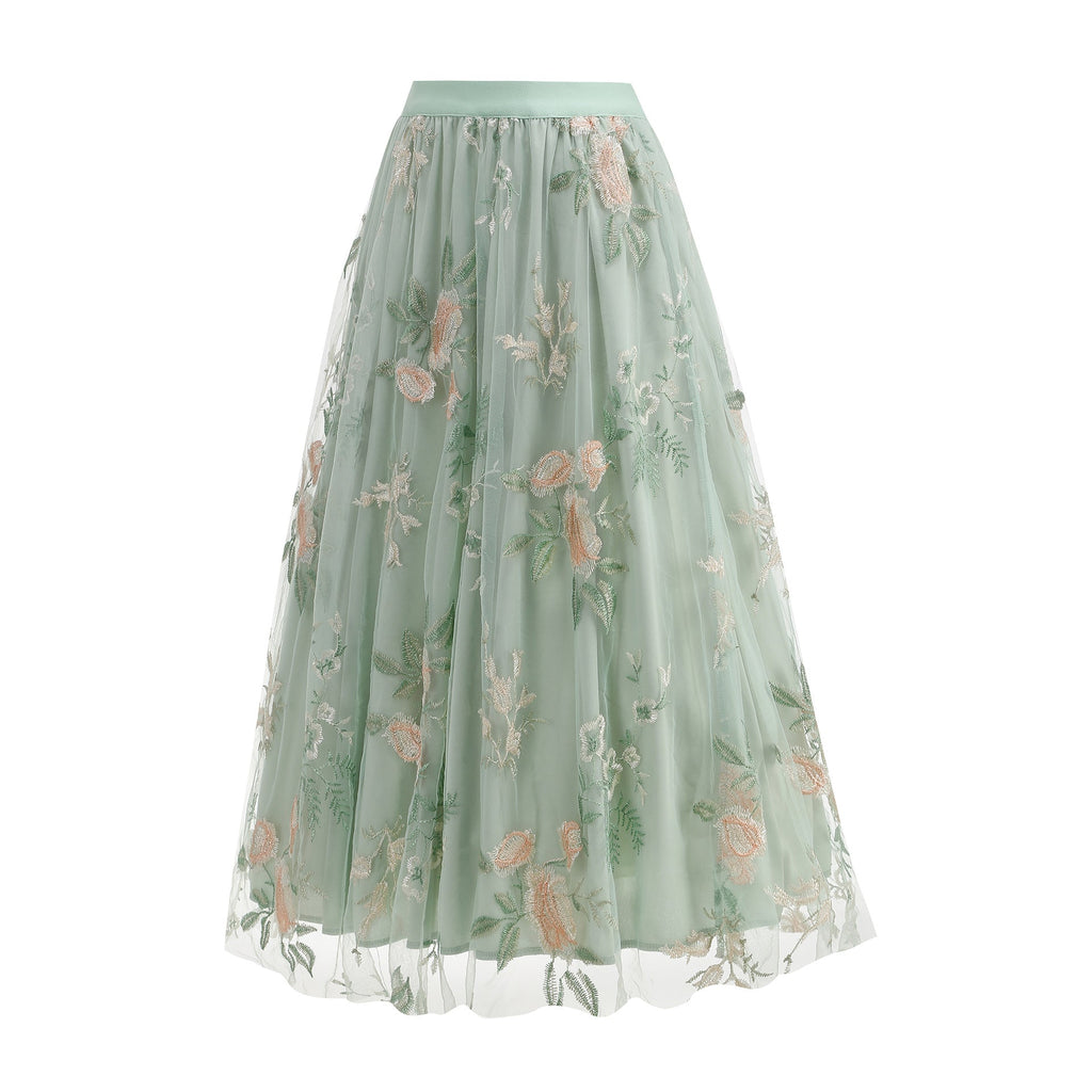 Green floral embroidered skirt on a white background
