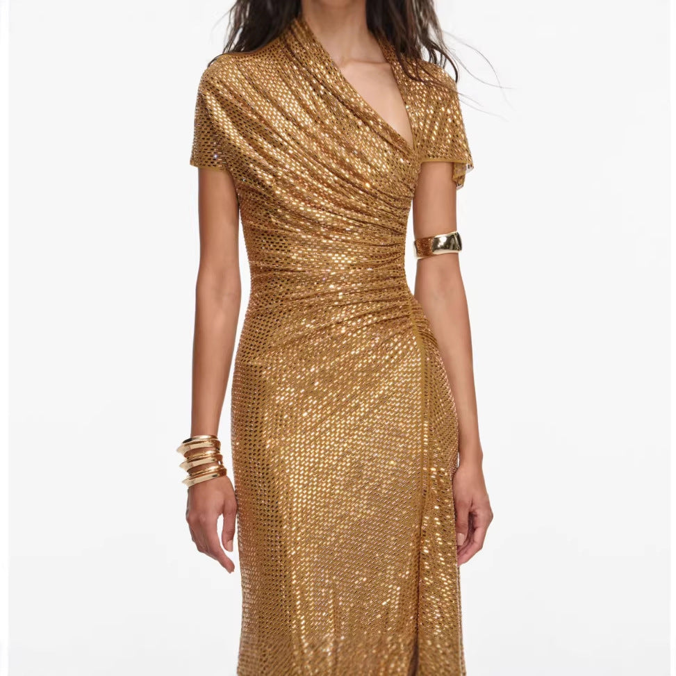 Gold sequin dress worn by a model on a white background