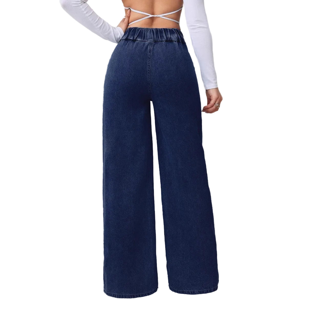 Person wearing blue wide-leg jeans with a white background