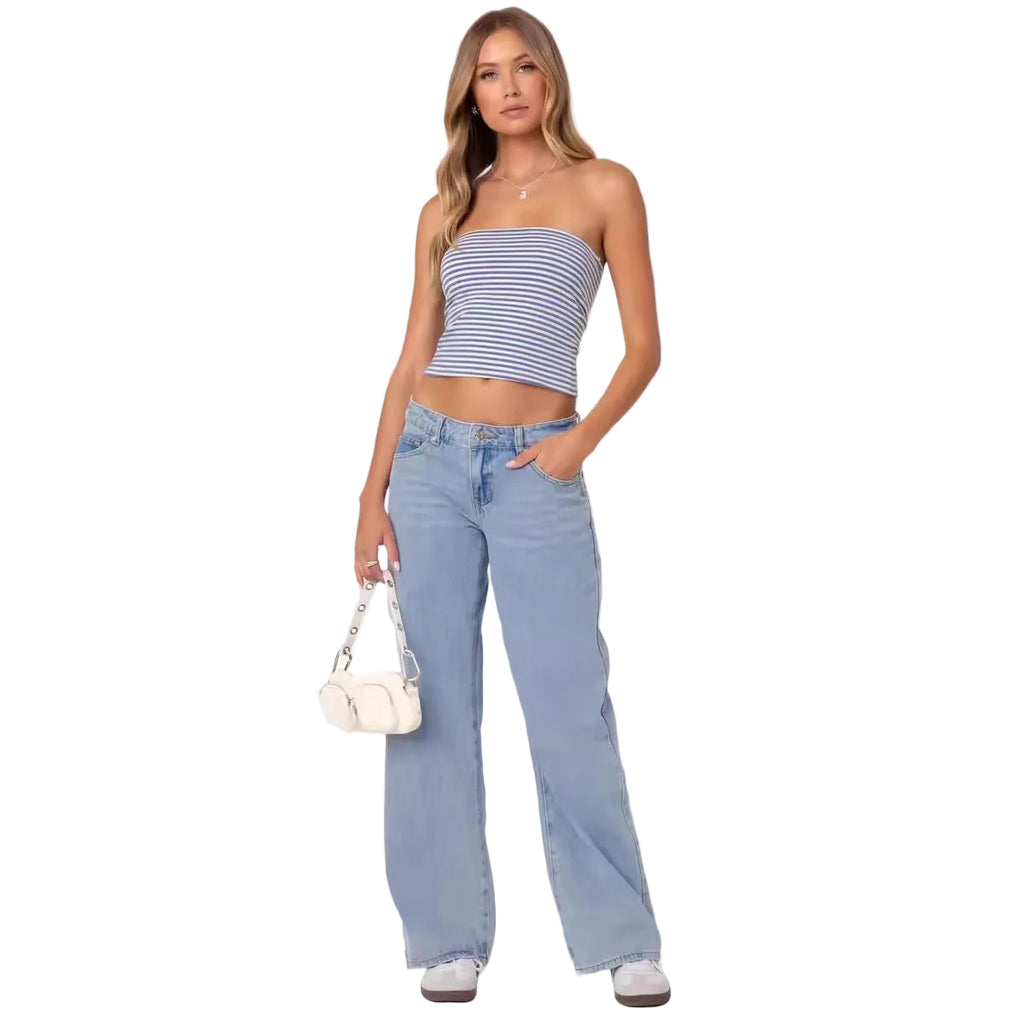 Woman wearing a striped top and blue jeans on a white background