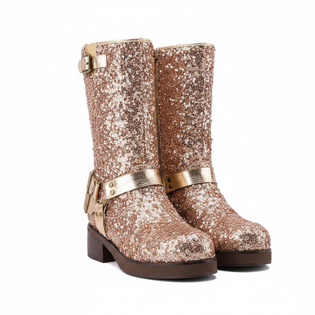 Pair of glittery boots with gold buckles on a white background
