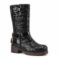 Black glittery boot with buckles on a white background