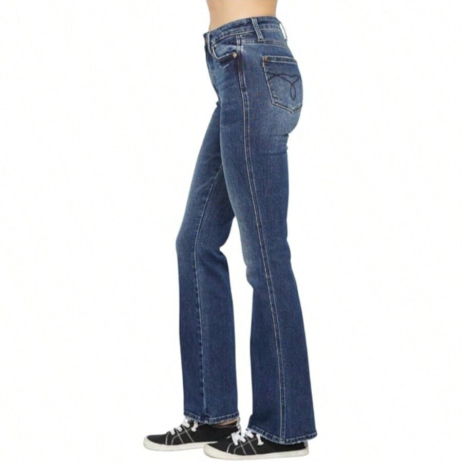 Blue jeans worn by a person on a white background