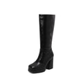 Black knee-high boot on a white background