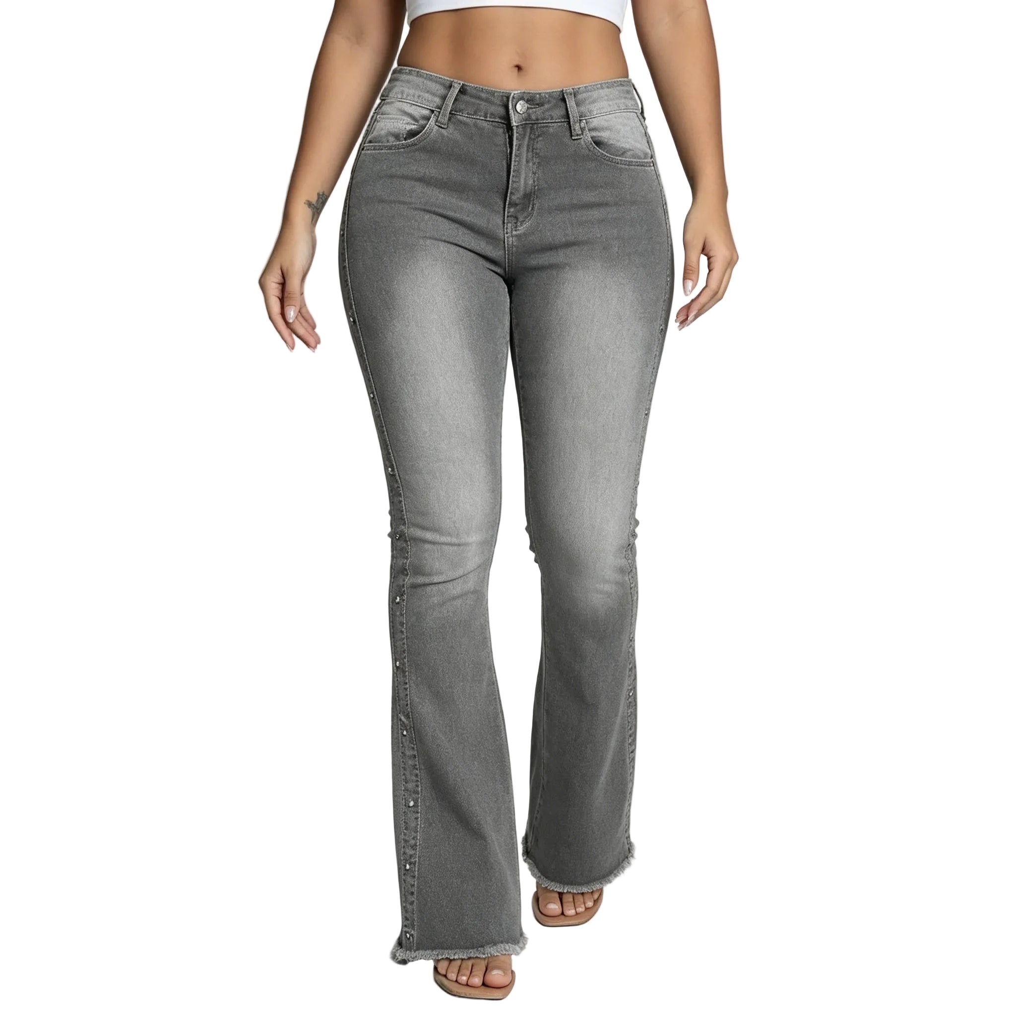 Person wearing gray flared jeans on a plain background