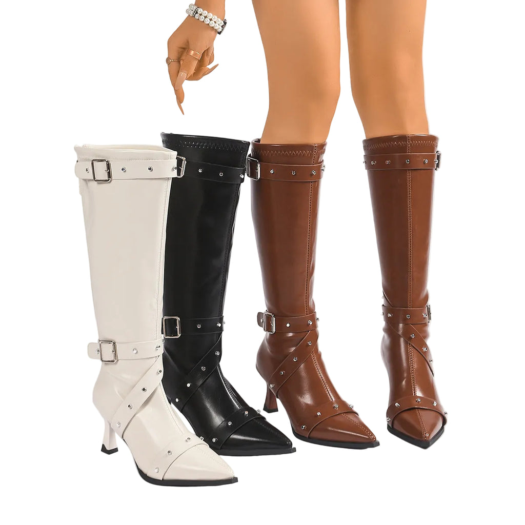 White, black, and brown knee-high boots with buckles on a white background